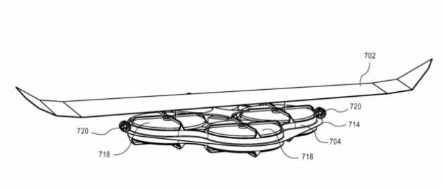 This configuration for a delivery drone shows a wide fixed wing as well as two “pushing” motors mounted on the sides of the drone’s shroud. (Credit: Amazon via USPTO)
