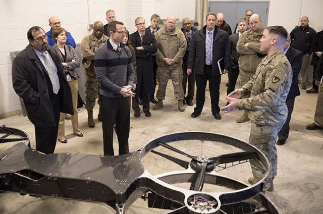 Sgt. 1st Class Daniel Guenther (right), U.S. Army Research Laboratory, shows the Joint Tactical Aerial Resupply Vehicle Model P-200 to DOD Strategic Capabilities Office Director Dr. William Roper (center) at Aberdeen Proving Ground, Maryland, Jan. 10, 2017. (U.S. Army photo by Jhi Scott)